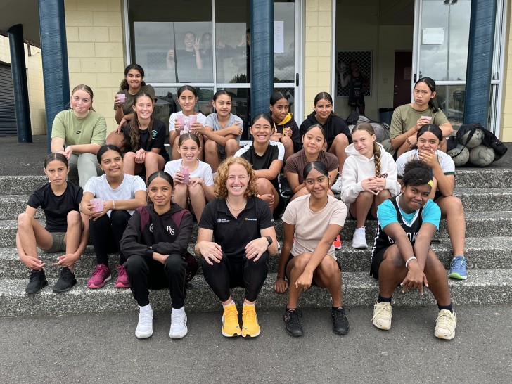 NetballSmart development officer Sam Winders with a group of school children.