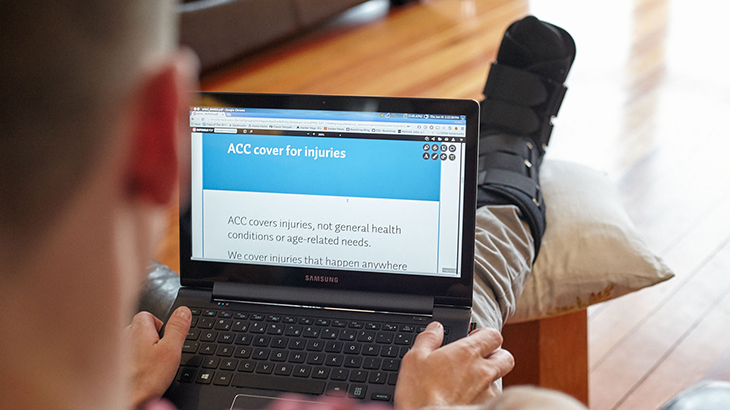 Acc On Website 109674 resized Man uses laptop with leg propped up in a moon boot